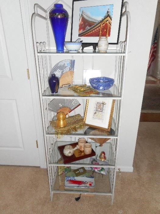 Metal and glass shelf unit with More Asian Art works and collectibles from Japan
