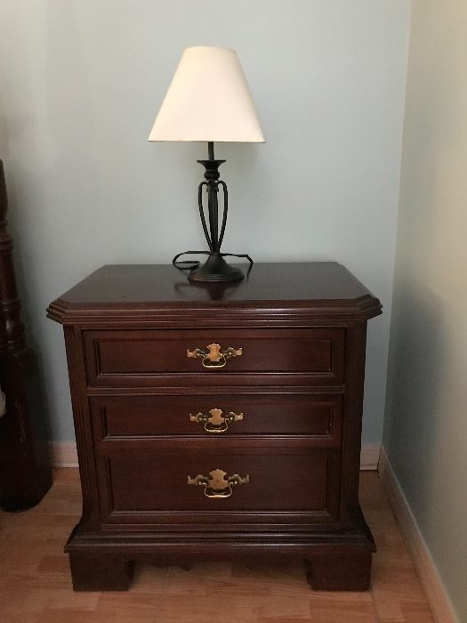 One of 2 nightstands matching the poster bed