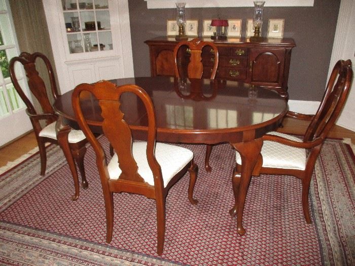 Drexel Dining table 64" long up to 100" when two 18" leaves are utilized.  Paired with 8 Bernhardt chairs.  Two Captains and 6 side chairs.  This photo shows table at 64" long.