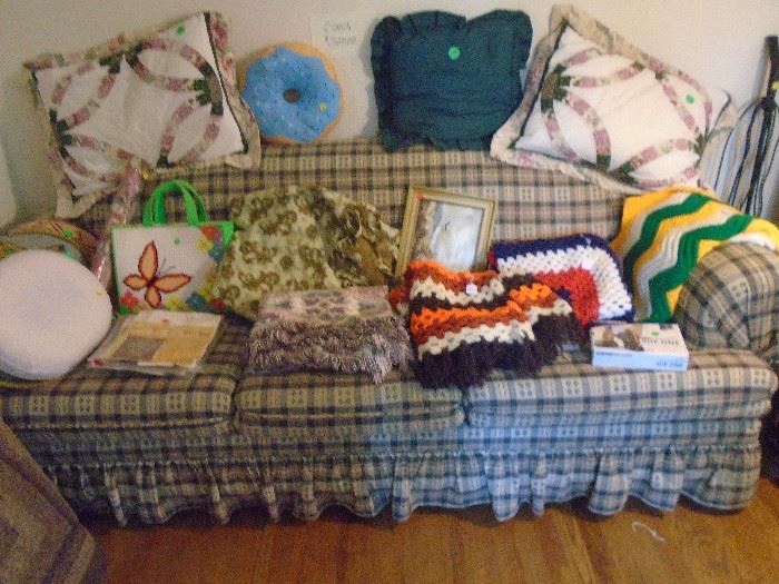 Nice couch with some misc. blankets, lamps and some vaccum sweepers in same room off of kitchen watch for steps! this room has a step down step to the room.