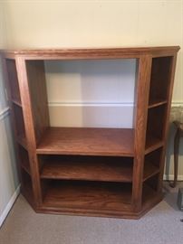 Oak entertainment center. Fits nicely as a corner unit or against a flat wall