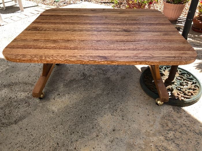 Table that folds up and down, has drop leaf on each side.  rolls and can be a fun game table, coffee table or children's table