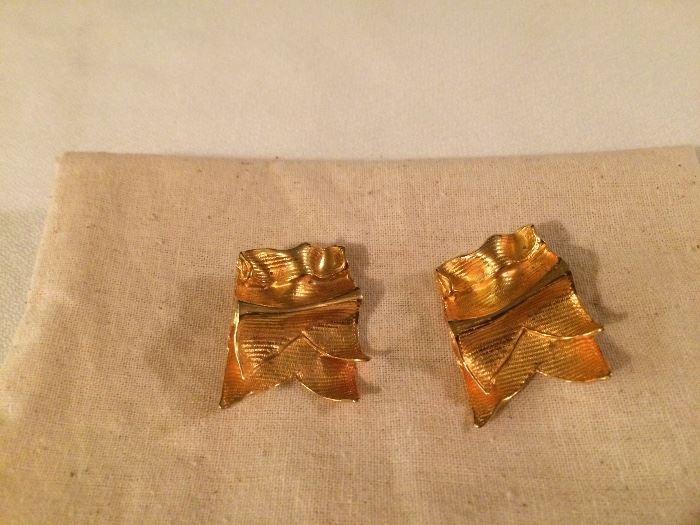 Gold clip earrings.  Faget