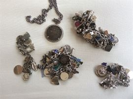 Charm bracelets--four total, some silver charms