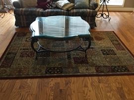 Rug is for sale under the coffee table