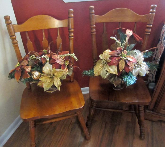 Dining table side chairs and artificial flower decorations