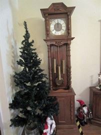 Lighted Christmas tree and grandfather clock (recently professionally cleaned and adjusted) 