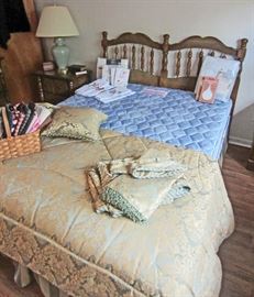 Full size bed and very nice bedding ensemble 
