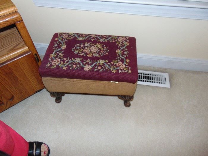 One of two vintage embroidered footstools