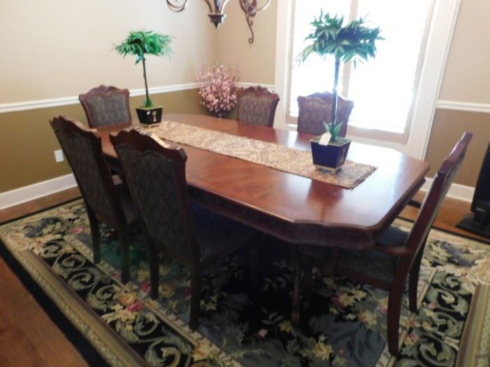 Solid wood dining table with 6 chairs 7 foot by 4 foot with leaf inserted.   Oriental Rug 10 foot by 7 Handwoven  
