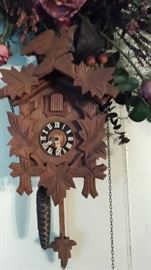 Coo coo clock with bird on top