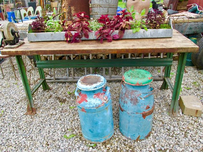 Vintage butcher block work bench, Antique milk cans, old chicken feeder planter