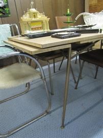 Mid-Century modern table with self storing leaves and 3 matching chairs