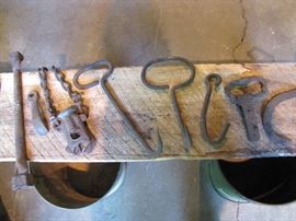 Hay hooks, ice tongs, and other small cast iron items