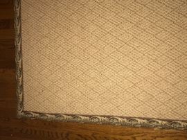 Large rug bound with tapestry edge. 