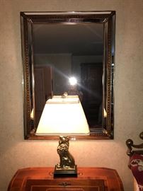 Large mirror and brass lion lamp