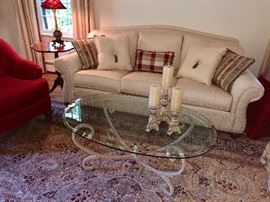 Oval, glass top, cocktail table.