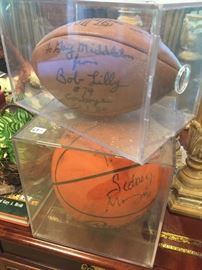 Football autographed by Bob Lilly
Basketball signed by Sidney Moncrief