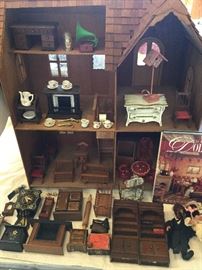 Back of doll house with doll house furniture