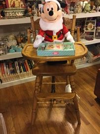 High chair has waist strap, tray flips around