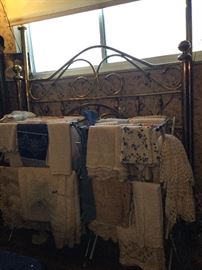 Queen size brass style bed, tons of linens