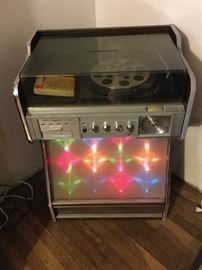 Morse electrophonic turntable, stereo, eight track player, when the volume is turned up the light show comes on