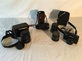 Assorted Camera Lens & 122 Zenit Camera in Case              https://ctbids.com/#!/description/share/26610