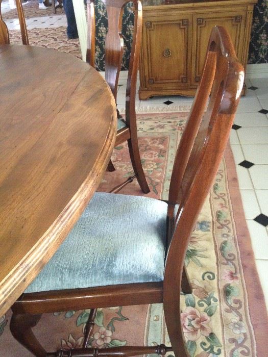Eight matching chairs fit nicely around the dining table.