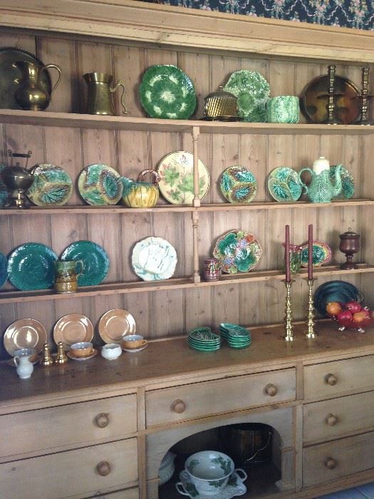 Fabulous collection of green majolica and other selections on this stunning antique breakfront