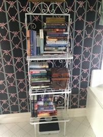 Small baker's rack with lots of books