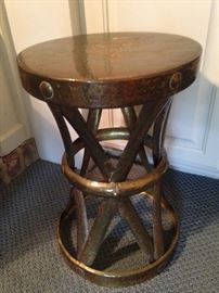 This is a brass stool or plant stand; OR turn it upside down, and it can be an umbrella stand.