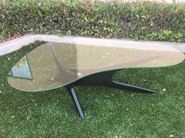 Kidney shaped coffee table by or in the style of Adrian Pearsall. 