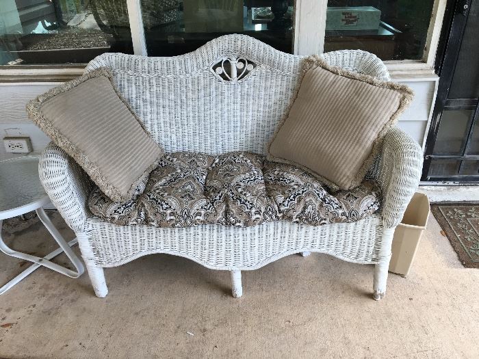 Wicker settee and cushions