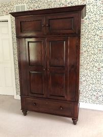 Stunning deep mahogany armoire with overhead and below storage 