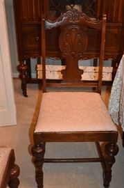 Beautiful Circa 1920's Dining Room Suite featuring Dining Table, 6 Matching Chairs, China Closet, and Buffet featuring Tudor Legs and Carvings