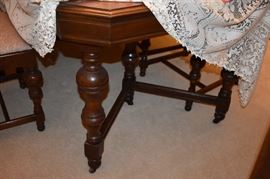 Beautiful Circa 1920's Dining Room Suite featuring Dining Table, 6 Matching Chairs, China Closet, and Buffet featuring Tudor Legs and Carvings