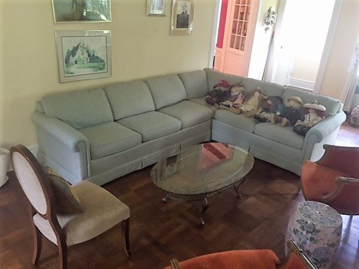 The Upholstered Sofa Is In Very Good Condition - along with the Glass and Iron Coffee Table
