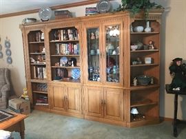 This is a 5 cabnet wall unit. 11 feet long 6’8” tall. It has lead glass doors and detailed trim. Asking $600.