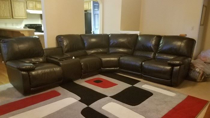 LIKE NEW SECRIONAL RECLINING SOFA WITH STORAGE.  NEW FROM FURNITURE ON CONSIGNMENT @ 2500.00. A FEW YEARS AGO