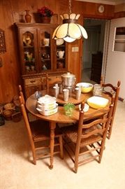 Kitchen table, four chairs and china cabinet.
