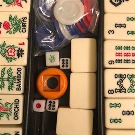 Portable Mahjong in a case http://www.ctonlineauctions.com/detail.asp?id=729004