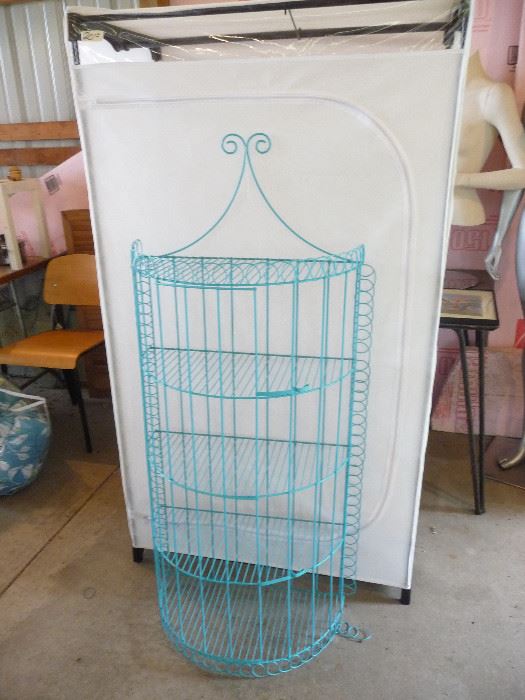 covered clothes rack / blue shelving 