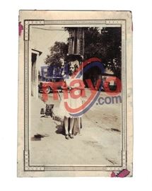 Bonnie Parker In Front Of a Gas Pump, Notice The Oil Bottles On The Ground Behind Her, Unknown Location, 2 5/8" x 3 7/8"
