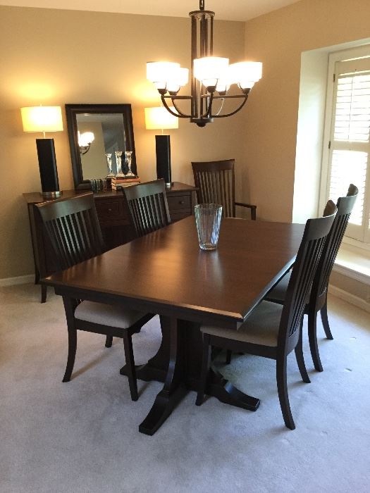 Custom made by Amish craftsman, dining room table includes chairs and table pads. EX CONDITION! Who do you know that could use this heirloom quality piece? 