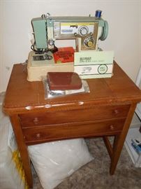 Vintage dressmaker electric sewing machine/ wooden machine cabinet each sold separately