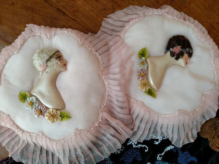Pair of ladies' bust figures on pillows