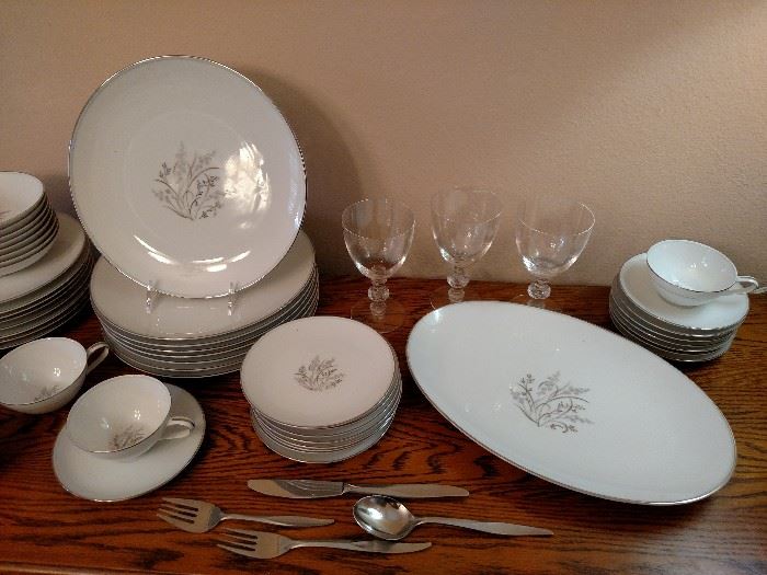Three Steuben glasses, china and stainless flatware 