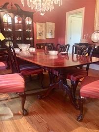 Dining room table with two large leaves and 10 chairs (2 of which are arm chairs)...All dining room furniture by Wellington Hall Hekman