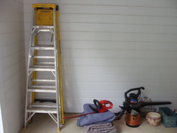2 ladders, 1- 6 foot and 1-8 foot, trimmer and blower