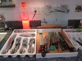 Orange Juice Lava Lamp. Assorted Cutlery, Knives, and Baking Items